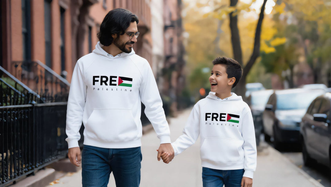 Father and son in matching FREE Palestine hoodies walking on a Brooklyn street