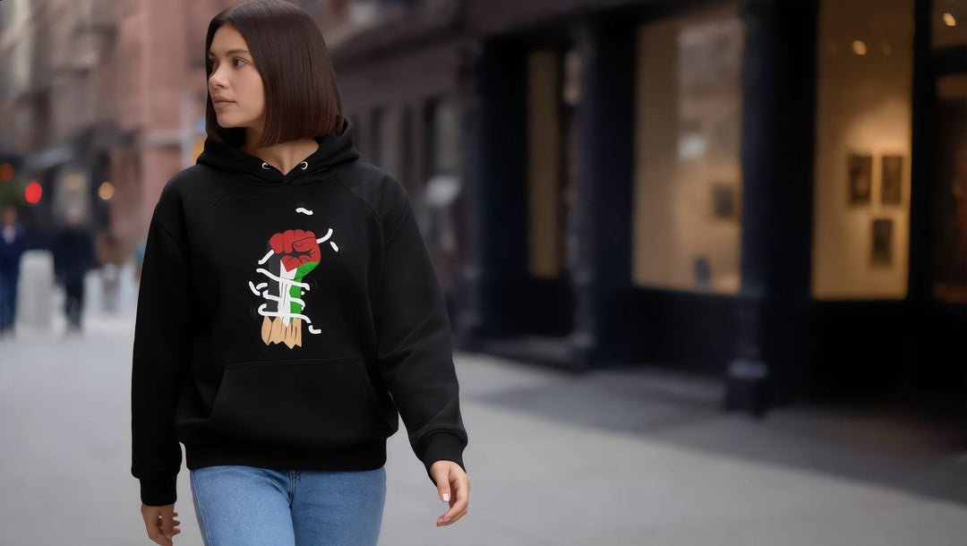 Woman in a Palestine Hand hoodie on Tenth Avenue in Chelsea, New York