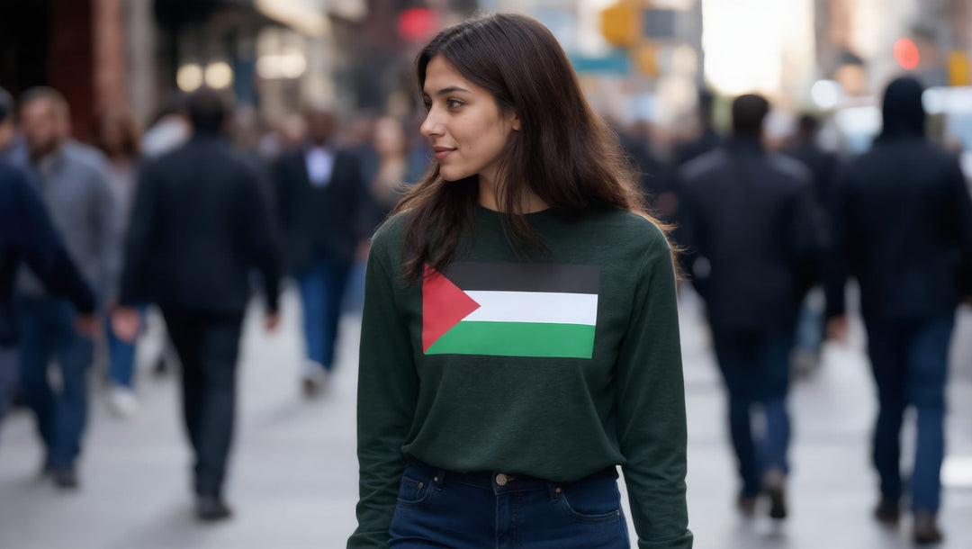 Woman in a green Palestine flag long sleeve shirt on a busy street in the East Village, New York