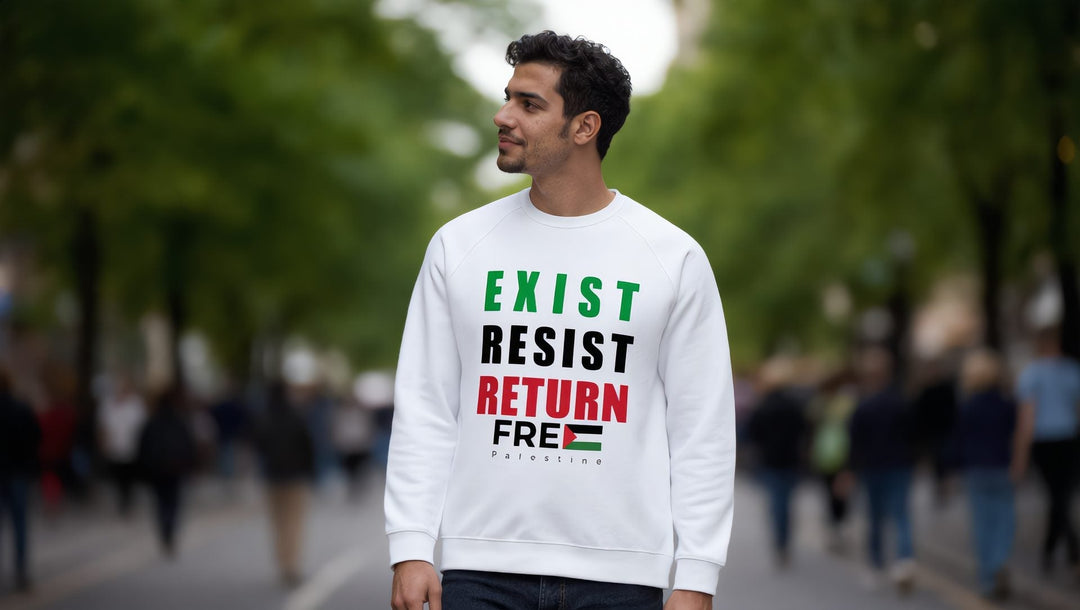 Man in a white Exist Resist Return sweatshirt on a street in Greenwich Village, New York