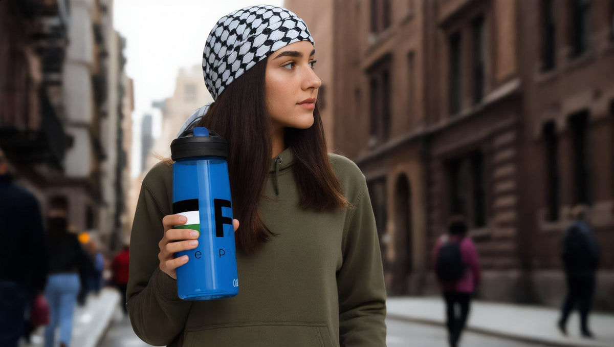 Woman holding a blue Free Palestine sports water bottle in Brooklyn, New York