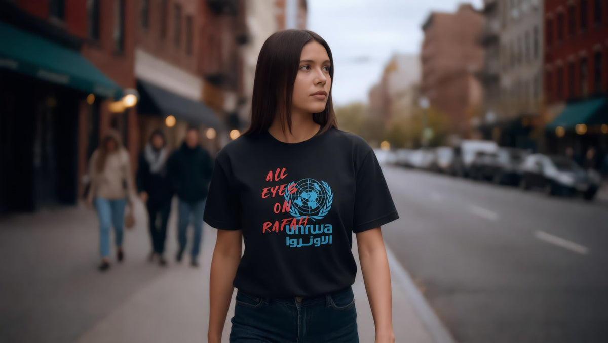 Woman wearing an All Eyes on Rafah T-shirt on Steinway Street, Astoria, New York