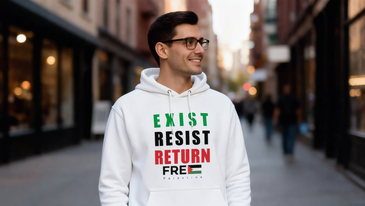 Man wearing a white Exist Resist Return hoodie on Mulberry Street, Nolita, New York